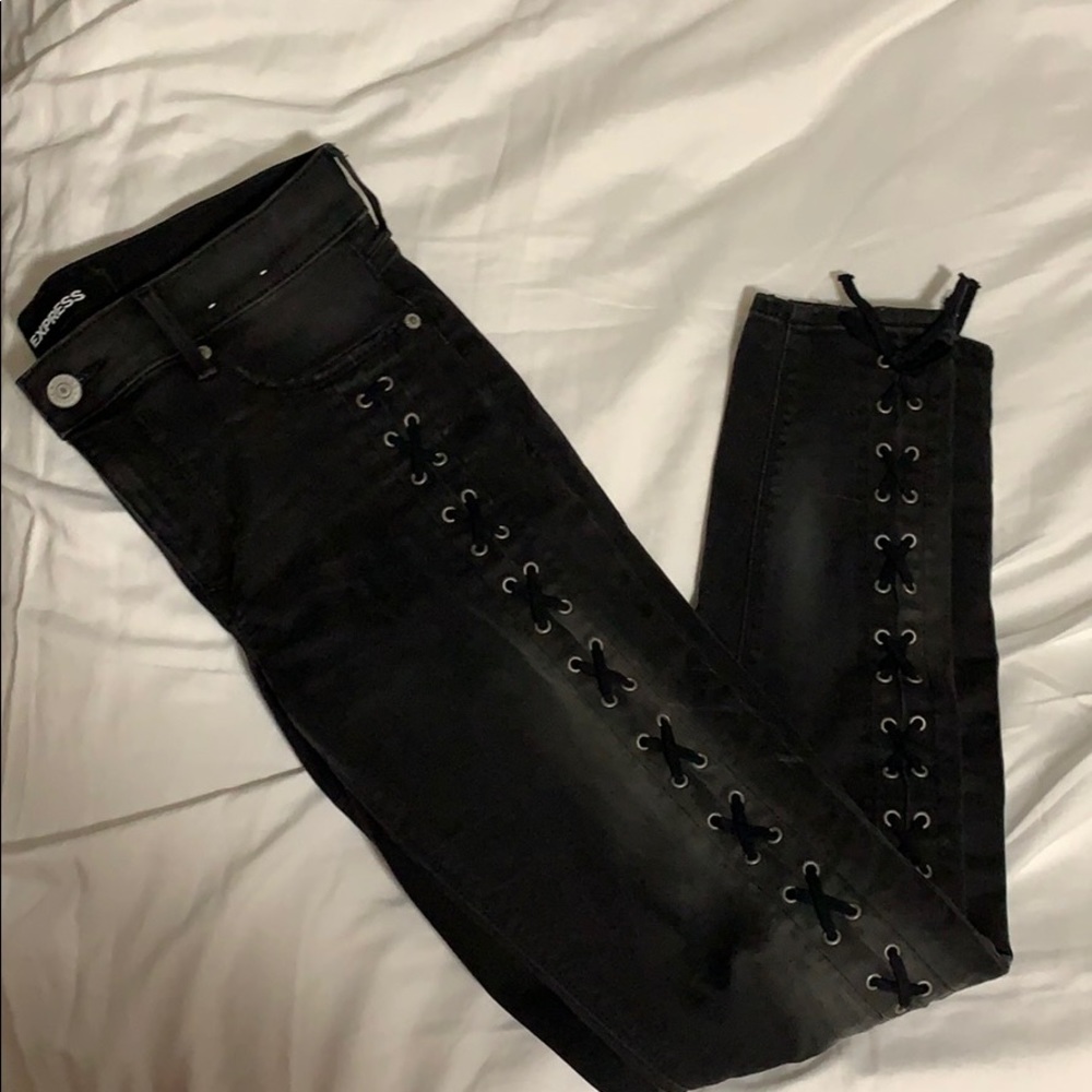 Black mid rise jeans with lacing on sides